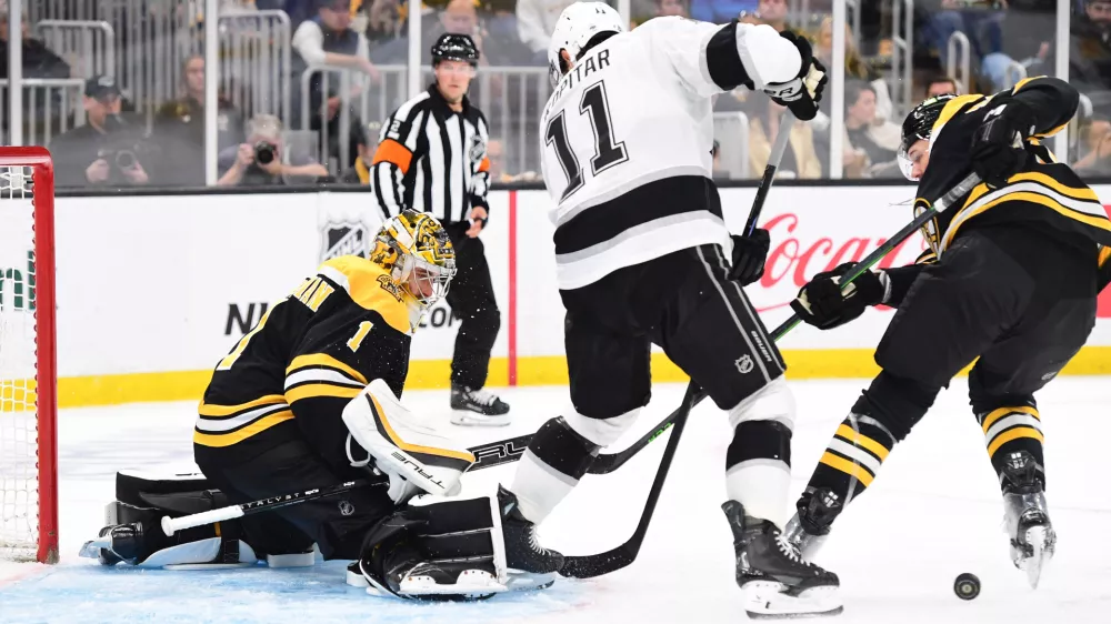 Oct 12, 2024; Boston, Massachusetts, USA; Los Angeles Kings center Anze Kopitar (11) looks for a rebound in front of Boston Bruins goaltender Jeremy Swayman (1) during the second period at TD Garden. Mandatory Credit: Bob DeChiara-Imagn Images