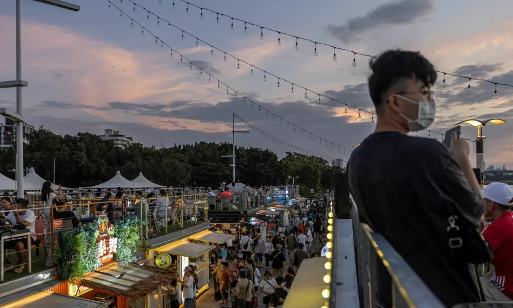 People visit a wharf market in Taipei, Taiwan, October 13, 2024. REUTERS/Tyrone Siu