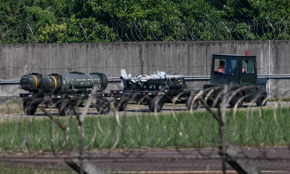 A transport vehicle carrying missiles and various munitions is seen at Hsinchu Air Base in Hsinchu, Taiwan October 14, 2024. REUTERS/Tyrone Siu