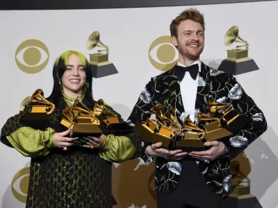 ﻿Billie Eilish, left, and Finneas O'Connell pose in the press room with the awards for best album, best engineered album and best pop vocal album for "We All Fall Asleep, Where Do We Go?," best song and record for "Bad Guy," best new artist and best producer, non-classical at the 62nd annual Grammy Awards at the Staples Center on Sunday, Jan. 26, 2020, in Los Angeles. (AP Photo/Chris Pizzello)