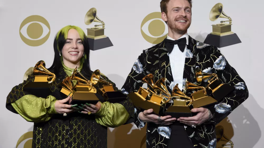 ﻿Billie Eilish, left, and Finneas O'Connell pose in the press room with the awards for best album, best engineered album and best pop vocal album for "We All Fall Asleep, Where Do We Go?," best song and record for "Bad Guy," best new artist and best producer, non-classical at the 62nd annual Grammy Awards at the Staples Center on Sunday, Jan. 26, 2020, in Los Angeles. (AP Photo/Chris Pizzello)