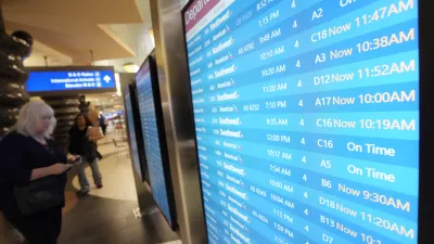 Passengers check a departures board at Phoenix Sky Harbor International Airport Friday, July 19, 2024, in Phoenix. An overnight outage was blamed on a software update that cybersecurity firm CrowdStrike sent to Microsoft computers of its corporate customers including many airlines. (AP Photo/Ross D. Franklin)