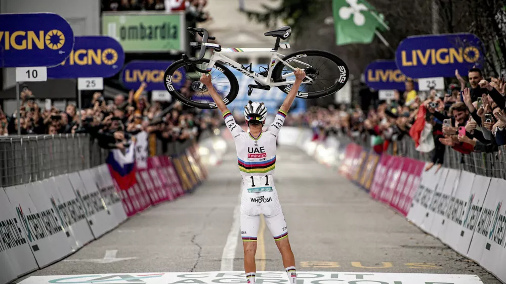 Reigning World Champion Slovenia's Tadej Pogacar celebrates winning Il Lombardia, Tour of Lombardy cycling race, in Como, Italy, Saturday, Oct. 12, 2024. (Marco Alpozzi/LaPresse via AP)