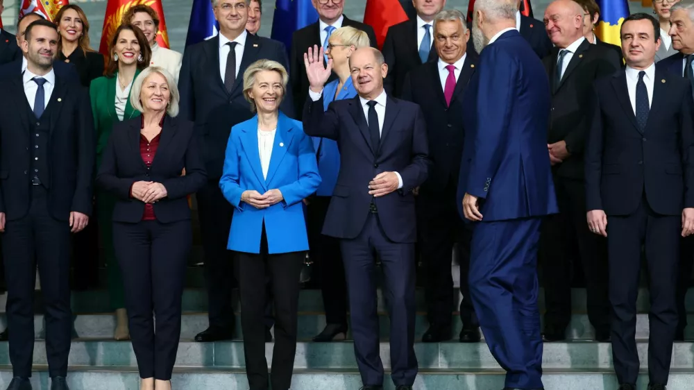 German Chancellor Olaf Scholz gestures during a family photo with European Commission President Ursula von der Leyen, Albania's Prime Minister Edi Rama, Hungarian Prime Minister Viktor Orban, Bulgaria's caretaker Prime Minister Dimitar Glavchev, Chairwoman of the Council of Ministers of Bosnia and Herzegovina Borjana Kristo, Kosovo's Prime Minister Albin Kurti, Croatian Prime Minister Andrej Plenkovic, Montenegro's Prime Minister Milojko Spajic, Slovenian President Natasa Pirc Musar, and other leaders from Western Balkan countries during the Berlin Process Summit, in Berlin, Germany, October 14, 2024. REUTERS/Lisi Niesner