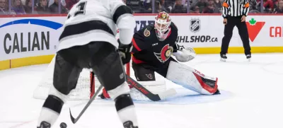 Oct 14, 2024; Ottawa, Ontario, CAN; Ottawa Senators goalie Mads Sogaard (40) follows Los Angeles Kings center Anze Kopitar (11) who controls the puck in the second period at the Canadian Tire Centre. Mandatory Credit: Marc DesRosiers-Imagn Images