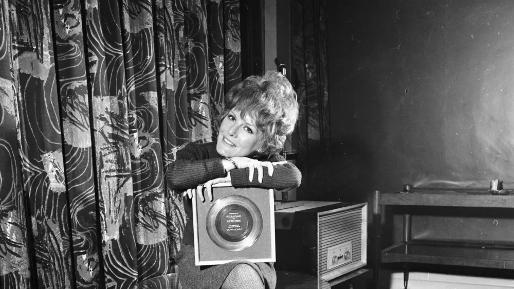 1st March 1965: English singer Petula Clark with a gold disc for her song 'Downtown'. (Photo by R. McPhedran/Express/Getty Images)