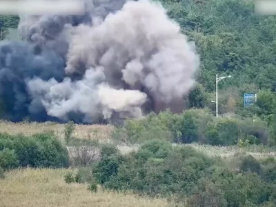 Smoke rises after North Korea blows up sections of inter-Korean roads on its side of the border between the two Koreas, according to South Korea's military, as seen from the South Korean side, October 15, 2024, in this screen grab from a handout video. South Korean Defence Ministry/Handout via REUTERS  THIS IMAGE HAS BEEN SUPPLIED BY A THIRD PARTY. STILL IMAGE TAKEN FROM VIDEO BLURRED AT SOURCE