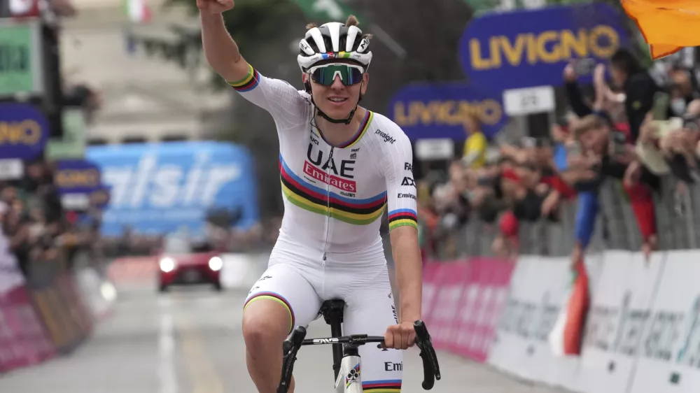 Reigning World Champion Slovenia's Tadej Pogacar celebrates winning Il Lombardia, Tour of Lombardy cycling race, in Como, Italy, Saturday, Oct. 12, 2024. (Gian Mattia D'Alberto/LaPresse via AP)