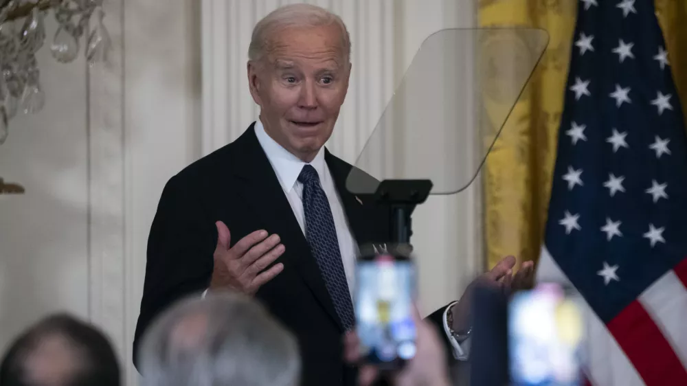 President Joe Biden makes a joke at a reception marking Italian-American Heritage Month, in the East Room of the White House in Washington, Wednesday, Oct. 16, 2024. (AP Photo/Ben Curtis)