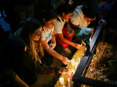 Fans place candles outside the hotel where Liam Payne, former One Direction member, was found dead, in Buenos Aires, Argentina, October 16, 2024. REUTERS/Agustin Marcarian