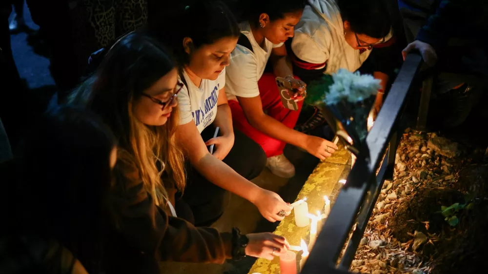 Fans place candles outside the hotel where Liam Payne, former One Direction member, was found dead, in Buenos Aires, Argentina, October 16, 2024. REUTERS/Agustin Marcarian