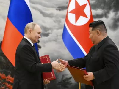 FILE - Russian President Vladimir Putin, left, and North Korea's leader Kim Jong Un exchange documents during a signing ceremony of the new partnership in Pyongyang, North Korea, on June 19, 2024. (Kristina Kormilitsyna, Sputnik, Kremlin Pool Photo via AP, File)