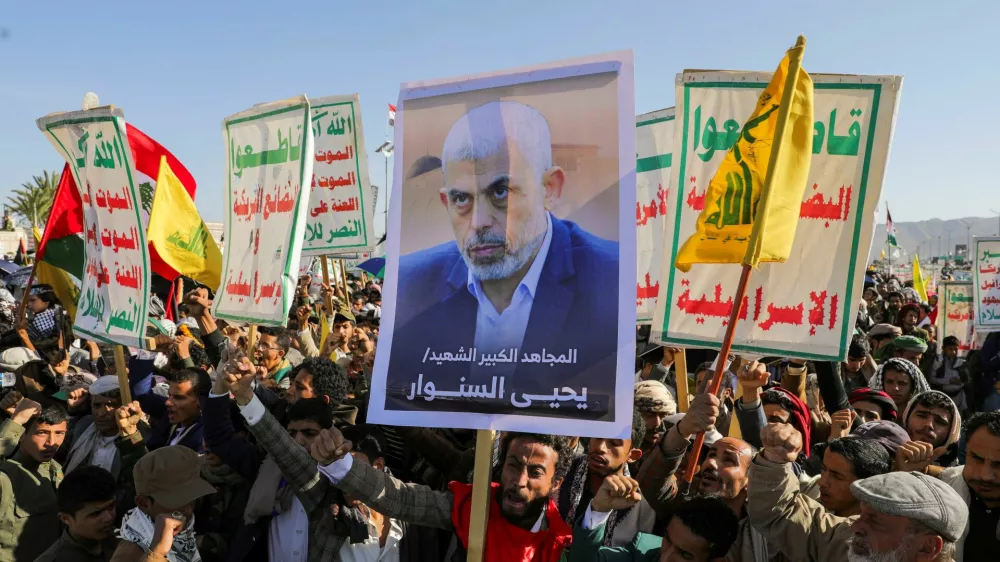 A person holds a sign showing the late Hamas leader Yahya Sinwar as protesters, mainly Houthi supporters, rally to show support to Lebanon's Hezbollah and Palestinians in the Gaza Strip, in Sanaa, Yemen October 18, 2024. REUTERS/Khaled Abdullah