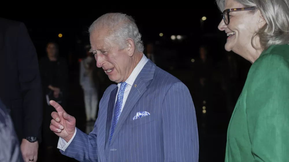 Britain's King Charles gestures as he talks with Ms Sam Mostyn, Governor-General of Australia on his arrival in Sydney for the start of a five-day tour to Australia, Friday, Oct. 18, 2024. (Brook Mitchell/Pool Photo via AP)