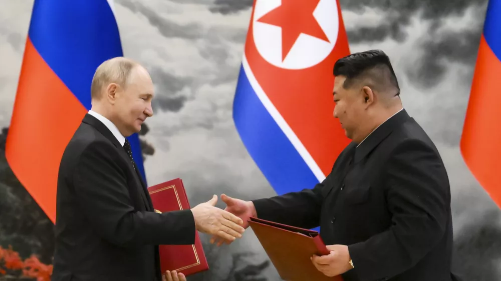 FILE - Russian President Vladimir Putin, left, and North Korea's leader Kim Jong Un exchange documents during a signing ceremony of the new partnership in Pyongyang, North Korea, on June 19, 2024. (Kristina Kormilitsyna, Sputnik, Kremlin Pool Photo via AP, File)