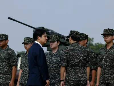 Taiwanese President Lai Ching-te visits a military base in response to recent Chinese military drills, in Taoyuan, Taiwan October 18, 2024. REUTERS/Tyrone Siu