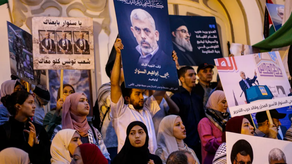 18 October 2024, Tunisia, Tunis: The images of Hamas leaders Yahya Sinwar and of Hezbollah leader Hassan Nasrallah are raised during a protest in Tunis against Israel's recent killing of Hamas leader Yahya Sinwar. Protesters held images of Sinwar and waived Palestinian flags and other symbols of the Palestinian resistance. Hamas' top leader Sinwar was killed by Israeli soldiers in Rafah, in the south of the Gaza Strip. Photo: Hasan Mrad/IMAGESLIVE via ZUMA Press Wire/dpa