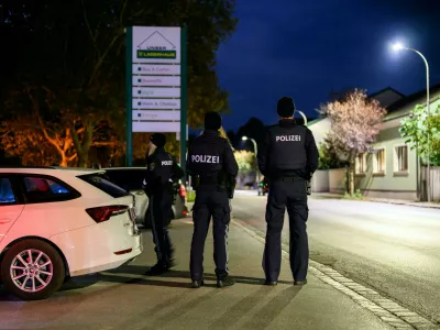 18 October 2024, Austria, Zistersdorf: Officers stand during a large-scale police operation in Zistersdorf in the district of Gaenserndorf. A blood crime had been discovered in the area of the municipality, the police announced. Photo: Max Slovencik/APA/dpa