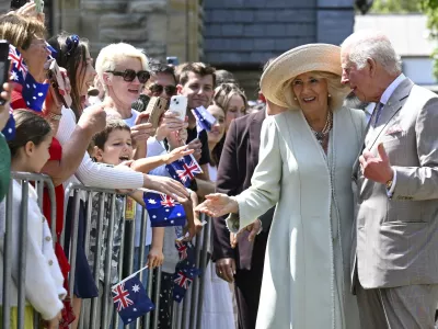 Britain's King Charles and Queen Camilla greet well wishers as they leave St Thomas' Anglican Church in Sydney, Sunday, Oct. 20, 2024. (Dean Lewins/Pool Photo via AP)