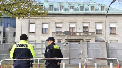 Police officers stand by the Israeli embassy in Berlin, Sunday, Oct. 20, 2024. (Paul Zinken/dpa via AP)