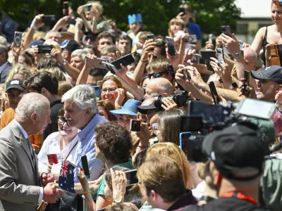 Britain's King Charles greets well wishers as they leave St Thomas' Anglican Church in Sydney, Sunday, Oct. 20, 2024. (Dean Lewins/Pool Photo via AP)