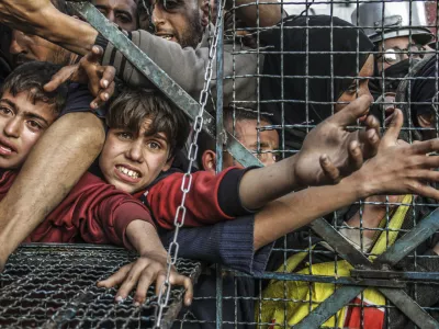 20 October 2024, Palestinian Territories, Gaza City: Palestinians, including children, line up to receive food distributed by charitable organizations as they struggle to obtain basic necessities, including essential food supplies. Photo: Mahmoud Issa/Quds Net News via ZUMA Press/dpa