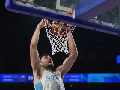 Slovenia center Mike Tobey (10) dunks against Australia in the first half of their Basketball World Cup group K match in Okinawa, southern Japan, Friday, Sept. 1, 2023. (AP Photo/Hiro Komae)