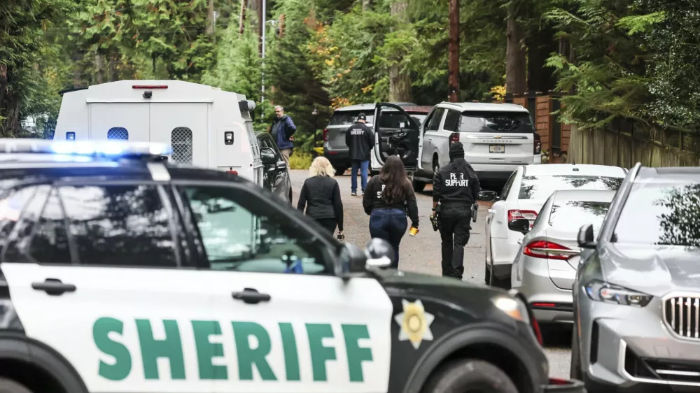 Police arrive on the scene of a shooting in Fall City, Washington, Monday, Oct. 21, 2024. (Kevin Clark/The Seattle Times via AP)