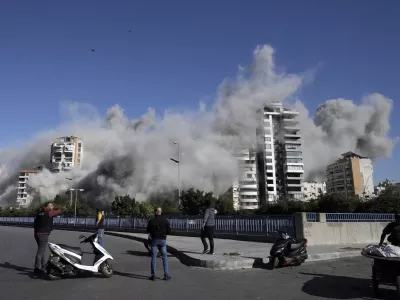 Smoke rises from a building that was hit by an Israeli airstrike in Ghobeiri, Beirut, Lebanon, Tuesday, Oct. 22, 2024. (AP Photo/Bilal Hussein)