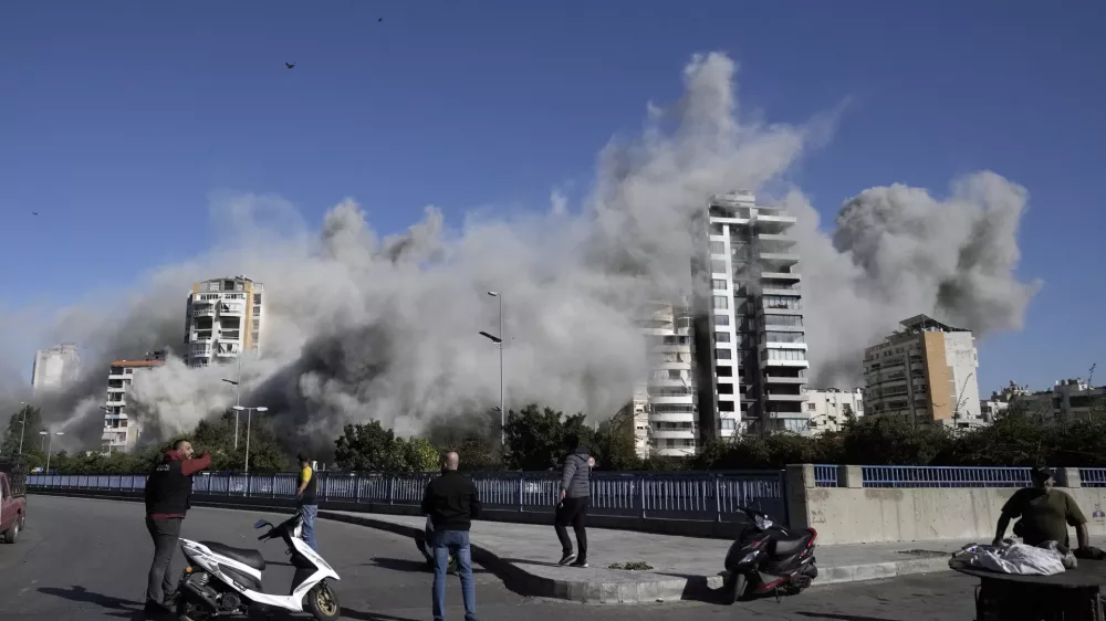 Smoke rises from a building that was hit by an Israeli airstrike in Ghobeiri, Beirut, Lebanon, Tuesday, Oct. 22, 2024. (AP Photo/Bilal Hussein)