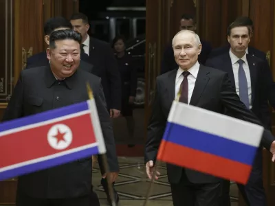 FILE - Russian President Vladimir Putin, right, and North Korea's leader Kim Jong Un smile during their meeting at the Pyongyang Sunan International Airport outside Pyongyang, North Korea, on June 19, 2024. (Gavriil Grigorov, Sputnik, Kremlin Pool Photo via AP, File)