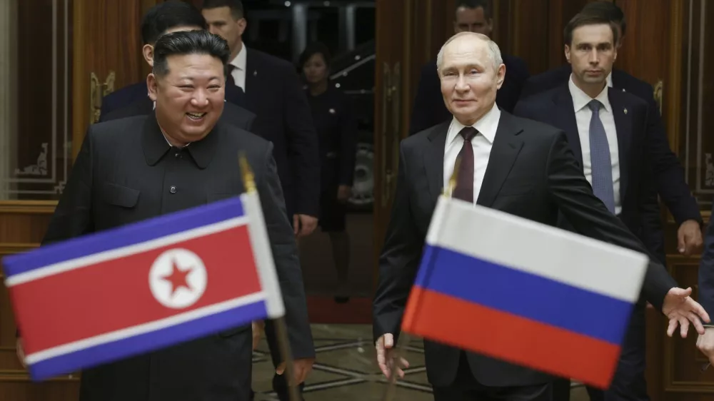 FILE - Russian President Vladimir Putin, right, and North Korea's leader Kim Jong Un smile during their meeting at the Pyongyang Sunan International Airport outside Pyongyang, North Korea, on June 19, 2024. (Gavriil Grigorov, Sputnik, Kremlin Pool Photo via AP, File)