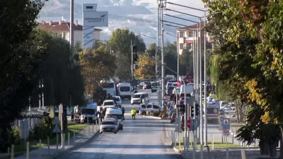 Emergency rescue teams and police officers work outside of Turkish Aerospace Industries Inc. on the outskirts of Ankara, Turkey, Wednesday, Oct. 23, 2024. (IHA via AP)