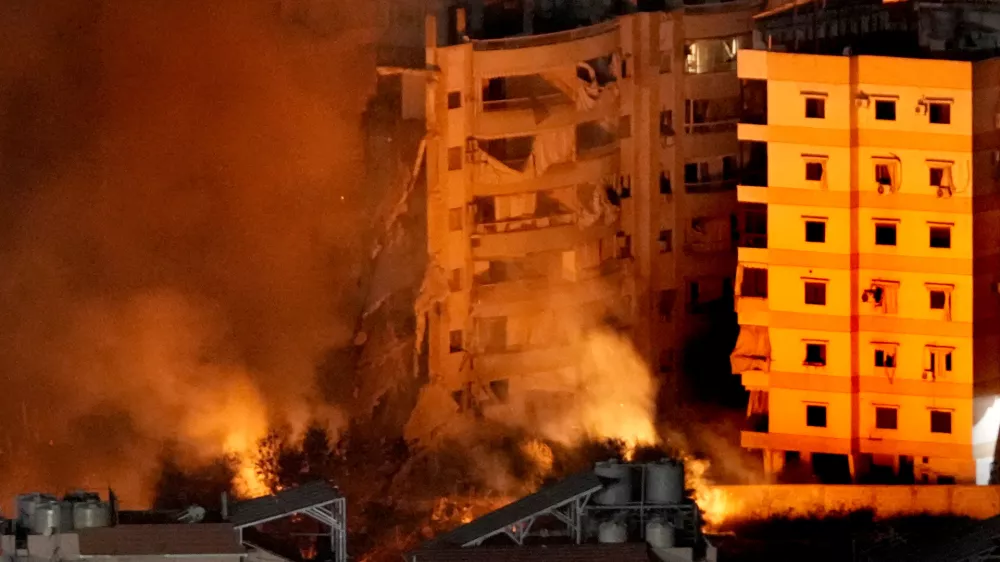 Flame and smoke rise from buildings hit by Israeli airstrikes on Dahiyeh, in the southern suburb of Beirut, Lebanon, Wednesday, Oct. 23, 2024. (AP Photo/Hussein Malla)