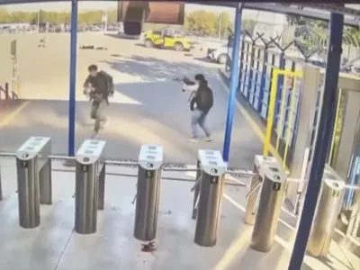 In this image take from security camera video shows two people with guns and backpacks during an attack on the premises of the Turkish state-run aerospace and defence company (TUSAS), on the outskirts of Ankara, Turkey, Wednesday Oct. 23, 2024. (Validated UGC via AP)