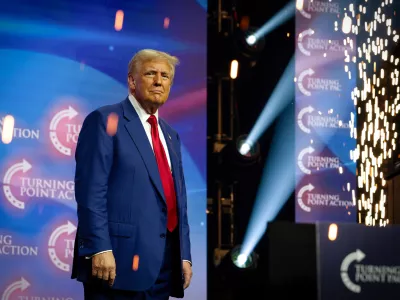 23 October 2024, US, Duluth: ormer US President and Republican presidential candidate Donald Trump is surrounded by sparks from a pyrotechnics display as he greets massive crowd of supporters at Gas South Arena. Photo: Robin Rayne/ZUMA Press Wire/dpa