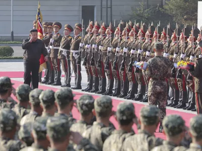 In this photo provided by the North Korean government, North Korean leader Kim Jong Un, left on red carpet, visits the headquarters of the North Korean People's Army's 2nd Corps at an undisclosed place in North Korea Thursday, Oct. 17, 2024. Independent journalists were not given access to cover the event depicted in this image distributed by the North Korean government. The content of this image is as provided and cannot be independently verified. (Korean Central News Agency/Korea News Service via AP)