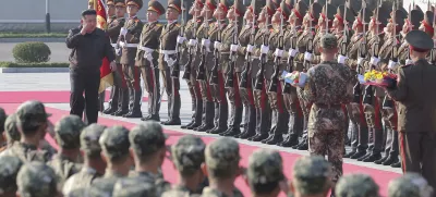 In this photo provided by the North Korean government, North Korean leader Kim Jong Un, left on red carpet, visits the headquarters of the North Korean People's Army's 2nd Corps at an undisclosed place in North Korea Thursday, Oct. 17, 2024. Independent journalists were not given access to cover the event depicted in this image distributed by the North Korean government. The content of this image is as provided and cannot be independently verified. (Korean Central News Agency/Korea News Service via AP)