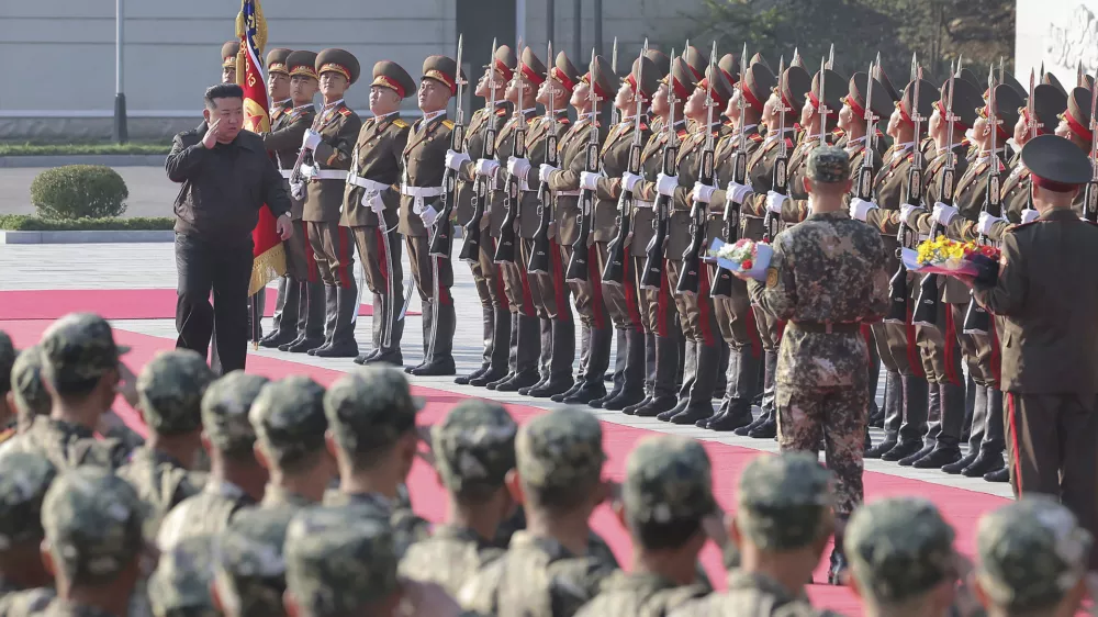 In this photo provided by the North Korean government, North Korean leader Kim Jong Un, left on red carpet, visits the headquarters of the North Korean People's Army's 2nd Corps at an undisclosed place in North Korea Thursday, Oct. 17, 2024. Independent journalists were not given access to cover the event depicted in this image distributed by the North Korean government. The content of this image is as provided and cannot be independently verified. (Korean Central News Agency/Korea News Service via AP)