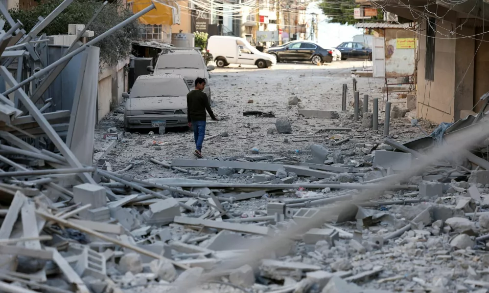 A person inspects the damage, following Israeli strikes, amid the ongoing hostilities between Hezbollah and Israeli forces, in Tyre, southern Lebanon, October 23, 2024. REUTERS/Aziz Taher