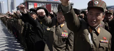 ﻿North Korean army officers punch the air as they chant slogans during a rally at Kim Il Sung Square in downtown Pyongyang, North Korea, Friday, March 29, 2013. Tens of thousands of North Koreans turned out for the mass rally at the main square in Pyongyang in support of their leader Kim Jong Un's call to arms. (AP Photo/Jon Chol Jin)