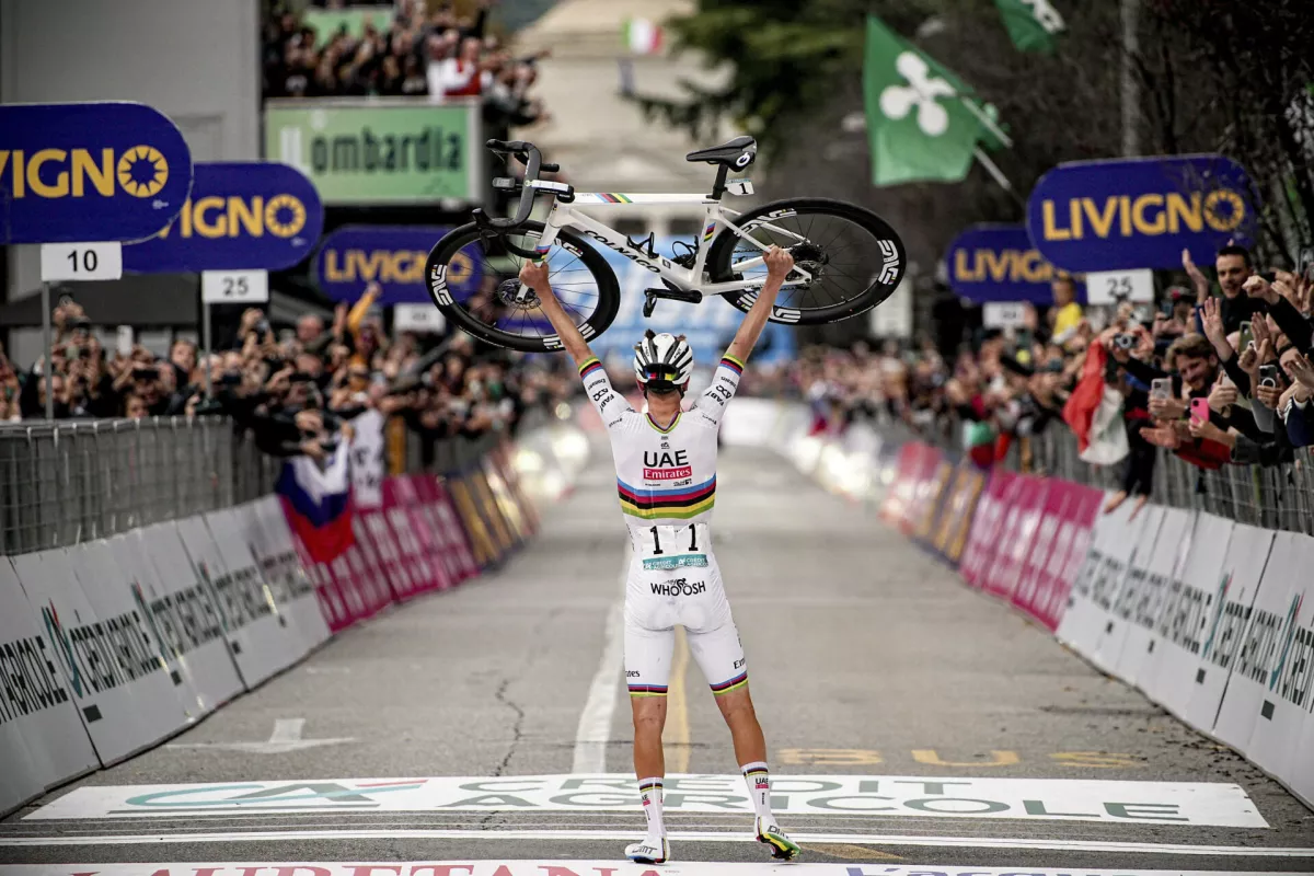 Reigning World Champion Slovenia's Tadej Pogacar celebrates winning Il Lombardia, Tour of Lombardy cycling race, in Como, Italy, Saturday, Oct. 12, 2024. (Marco Alpozzi/LaPresse via AP)