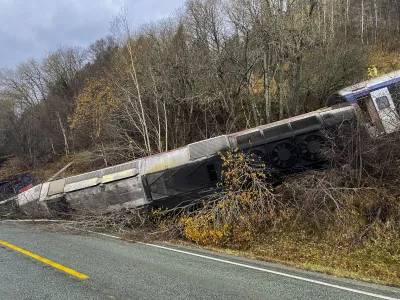 24 October 2024, Norway, Finneidfjord: A derailed train seen between the trees after derailing on the Finneidfjord in Nordland. Photo: Jan Kenneth Transeth/NTB/dpa