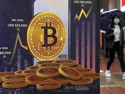 FILE - An advertisement for Bitcoin cryptocurrency is displayed on a street in Hong Kong, on Feb. 17, 2022. Bitcoin briefly hit an all-time high Tuesday, March 5, 2024, with the world's largest cryptocurrency surpassing ,800, according to CoinMarketCap. (AP Photo/Kin Cheung, File)