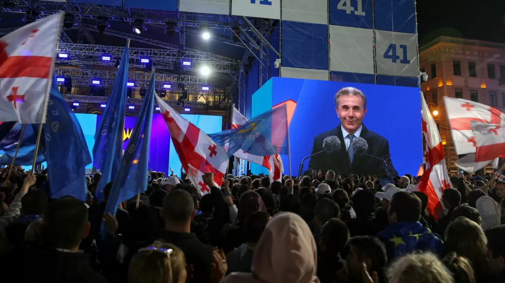 Founder of the Georgian Dream party Bidzina Ivanishvili is seen on a screen as he attends a final campaign rally held by the party's supporters ahead of the upcoming parliamentary elections in Tbilisi, Georgia October 23, 2024. REUTERS/Irakli Gedenidze