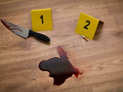 KHE6FC knife in blood and evidence marker at crime scene