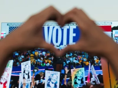 A supporter holds up their hands in heart shape as they attend Democratic presidential nominee U.S. Vice President Kamala Harris' campaign rally in Atlanta, Georgia, U.S., October 24, 2024. REUTERS/Megan Varner  TPX IMAGES OF THE DAY