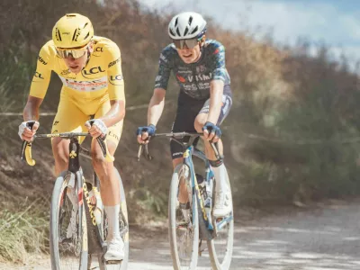 2XGAE1N Troyes, France. 07th July, 2024. Cycling - 2024 Tour de France - Stage 9 Troyes - Troyes, France - Tadej Pogacar, UAE Team Emirates, followed by Jonas Vingegaard, Visma Lease a Bike. Credit: SWpix/Alamy Live News Credit: SWpix/Alamy Live News