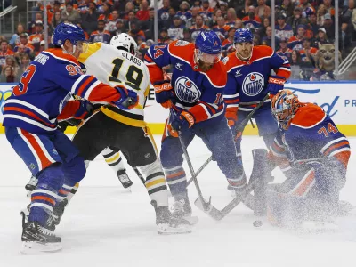 Oct 25, 2024; Edmonton, Alberta, CAN; Pittsburgh Penguins forward Cody Glass (19) looks for a loose puck in front of Edmonton Oilers goaltender Stuart Skinner (74) during the second period at Rogers Place. Mandatory Credit: Perry Nelson-Imagn Images