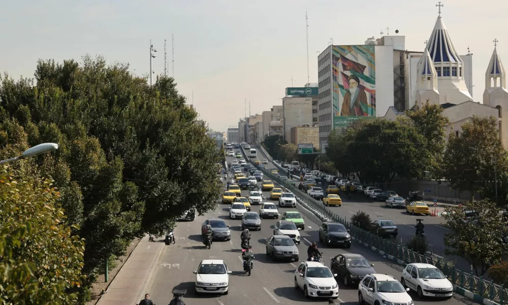 Cars pass on a street after several explosions were heard, in Tehran, Iran, October 26, 2024. Majid Asgaripour/WANA (West Asia News Agency) via REUTERS ATTENTION EDITORS - THIS IMAGE HAS BEEN SUPPLIED BY A THIRD PARTY